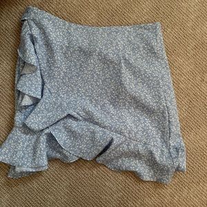 2 shein skirts the blue skirt is size small the black heart skirt is medium